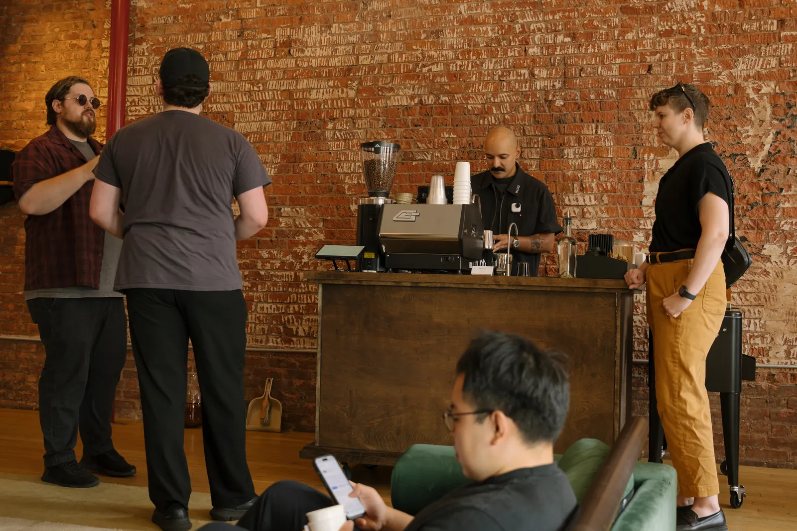 Guests gathered at the ValdezNY espresso cart as a barista pulls shots on the La Marzocco GS3