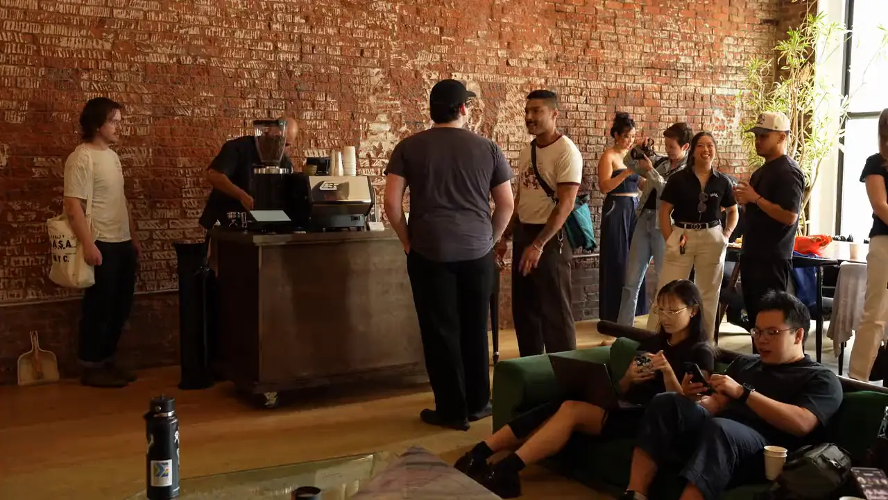 The ValdezNY espresso cart serving guests in a brick-walled loft